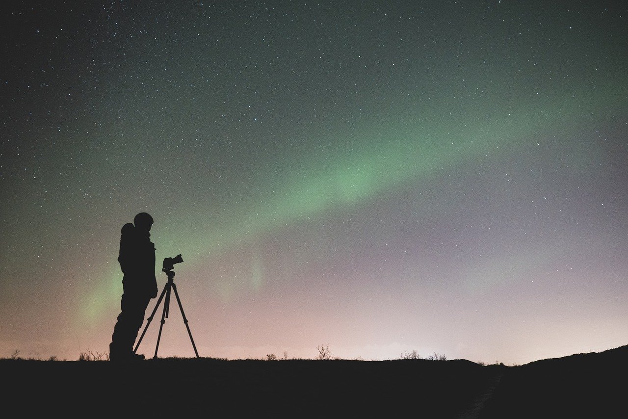 photographer observing the night sky