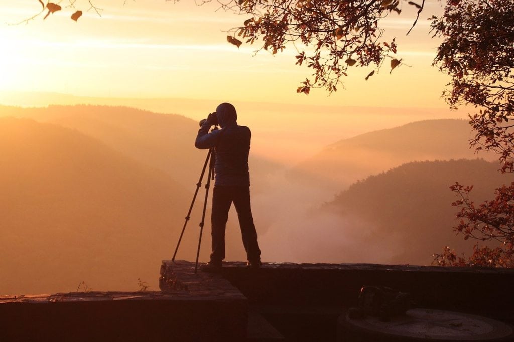 photographer during sunrise