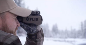man using FLIR Systems Scout III 320 Thermal Night Vision Monocular
