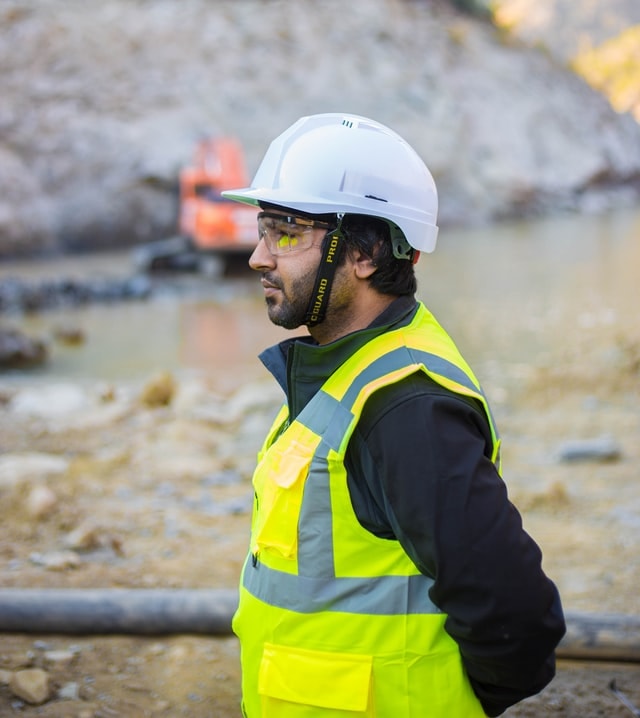 man wearing helmet and safety glasses