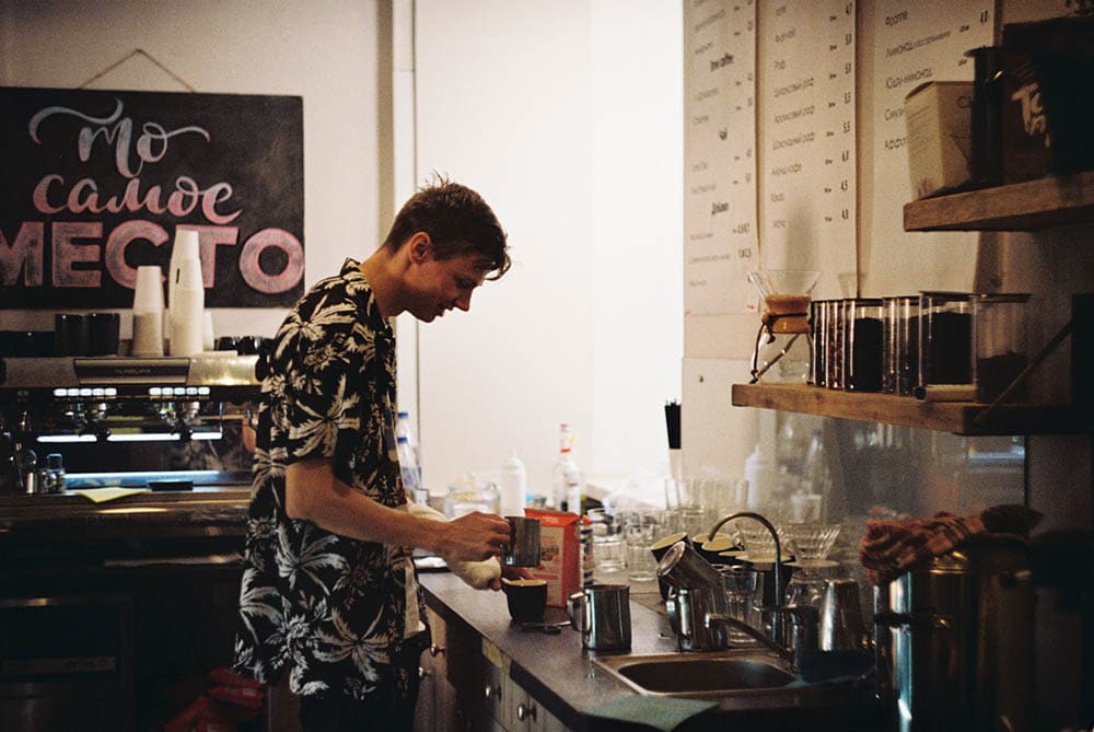 rustic photo of a barista preparing coffee