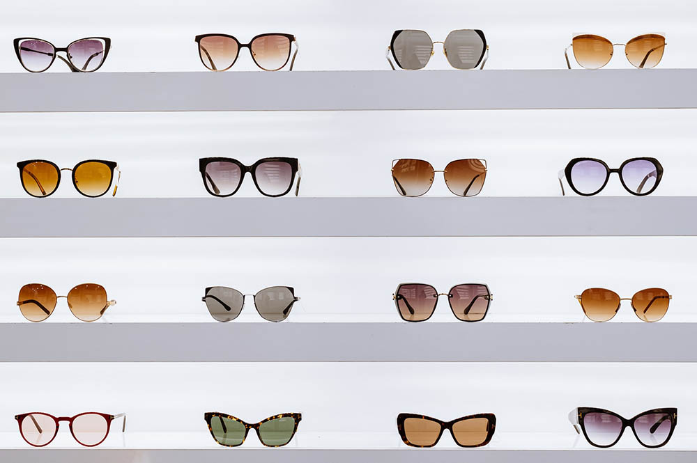 variety of sunglasses displayed on shelves