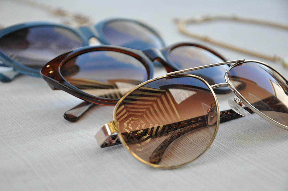 close up different sunglasses lined up together