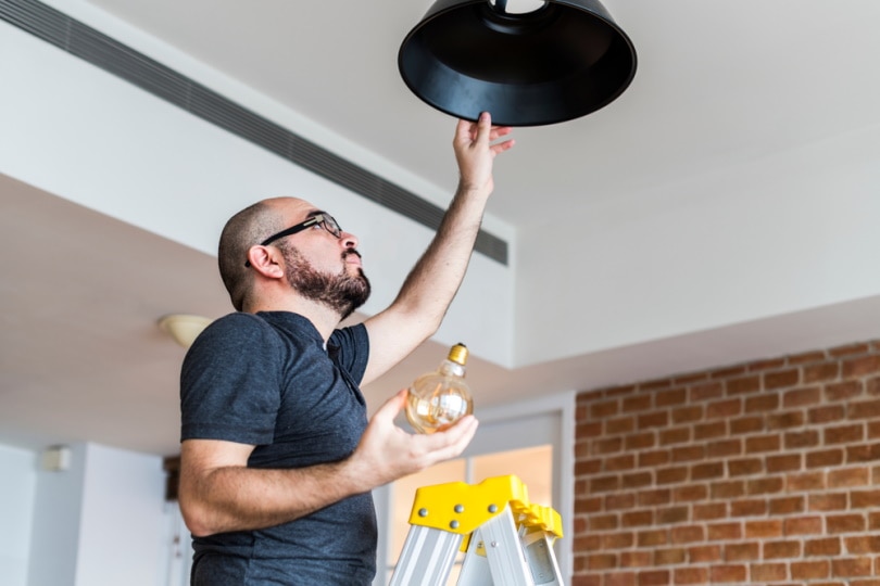 man changing bulb