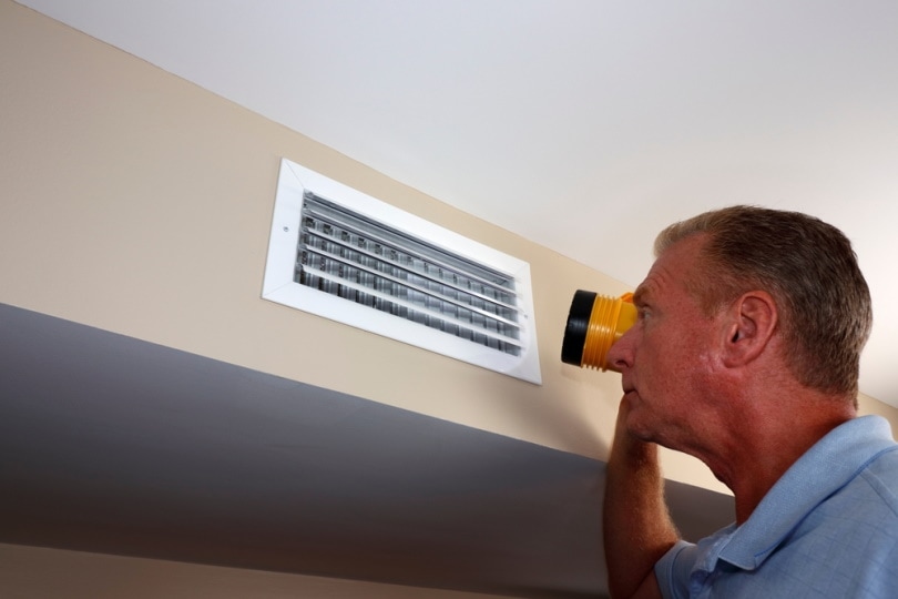man using flashlight