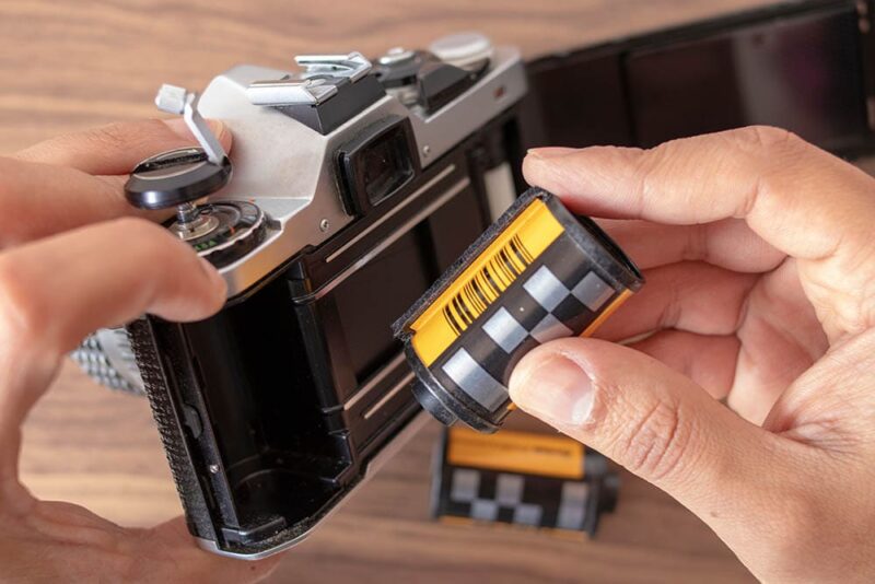 person removing film on the camera