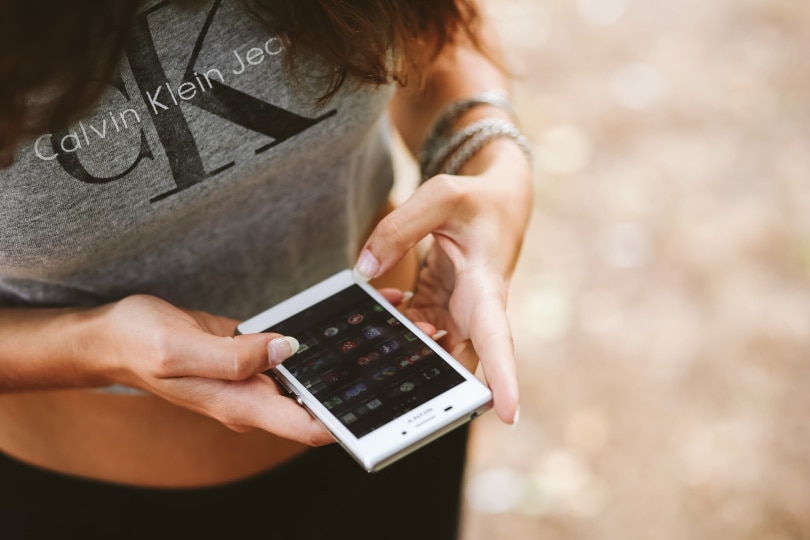 woman holding smartphone
