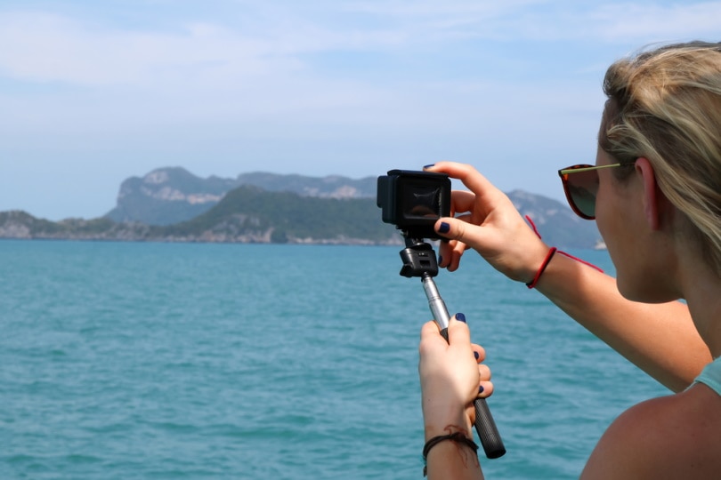 woman using GoPro camera