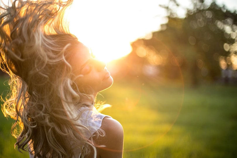 a photograph of a woman outdoor
