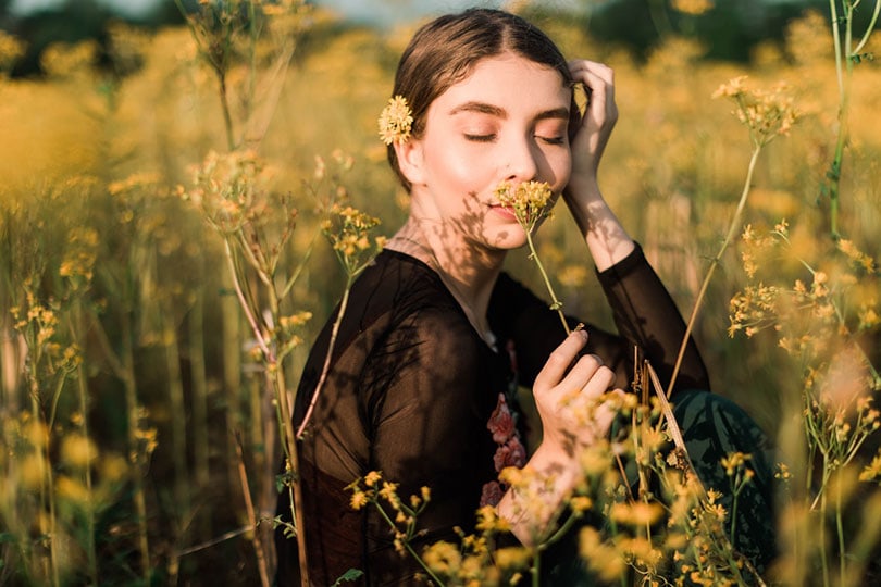 a young woman in a flower field