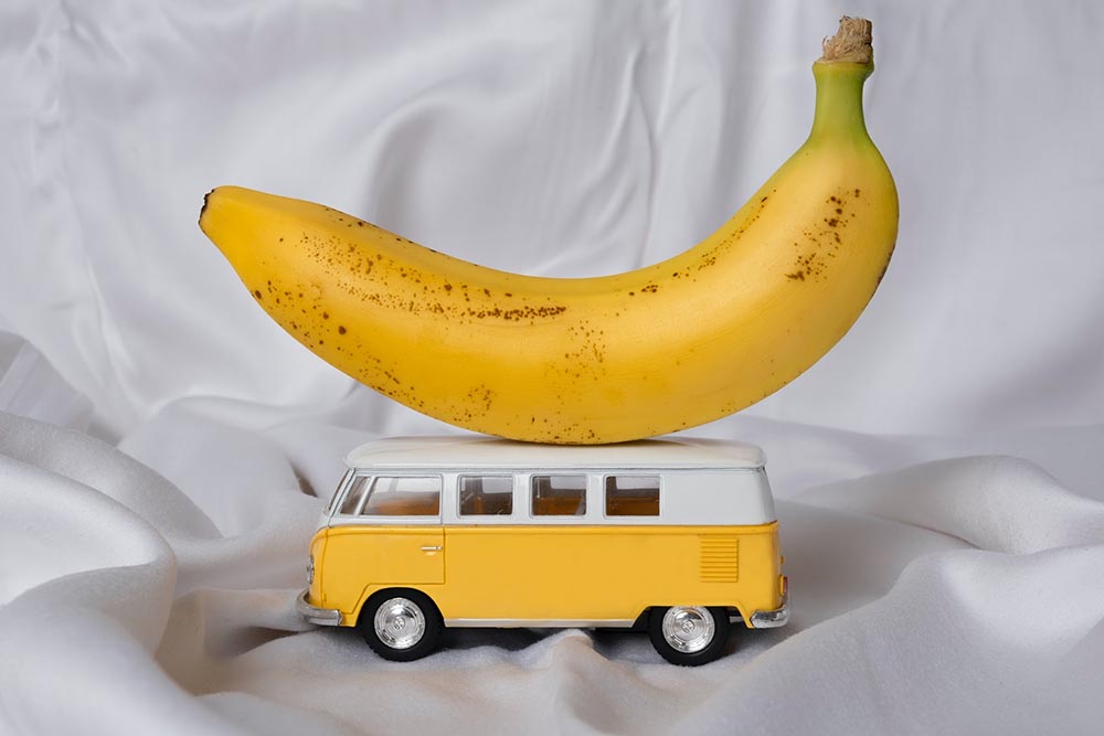 banana on top of a vintage van toy