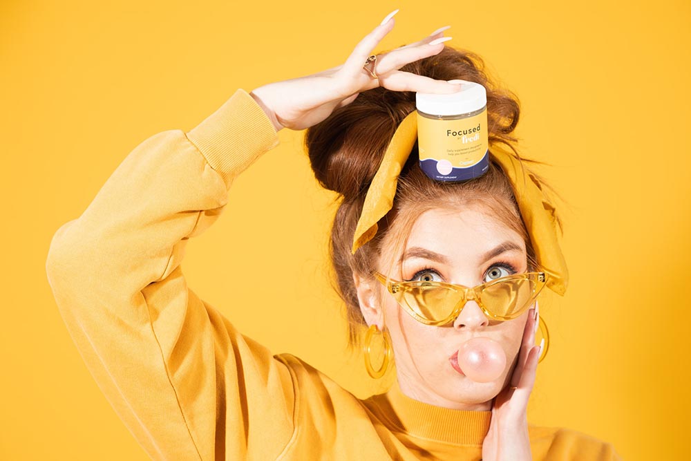 bubbly woman with Focused by Fredi supplement on her head