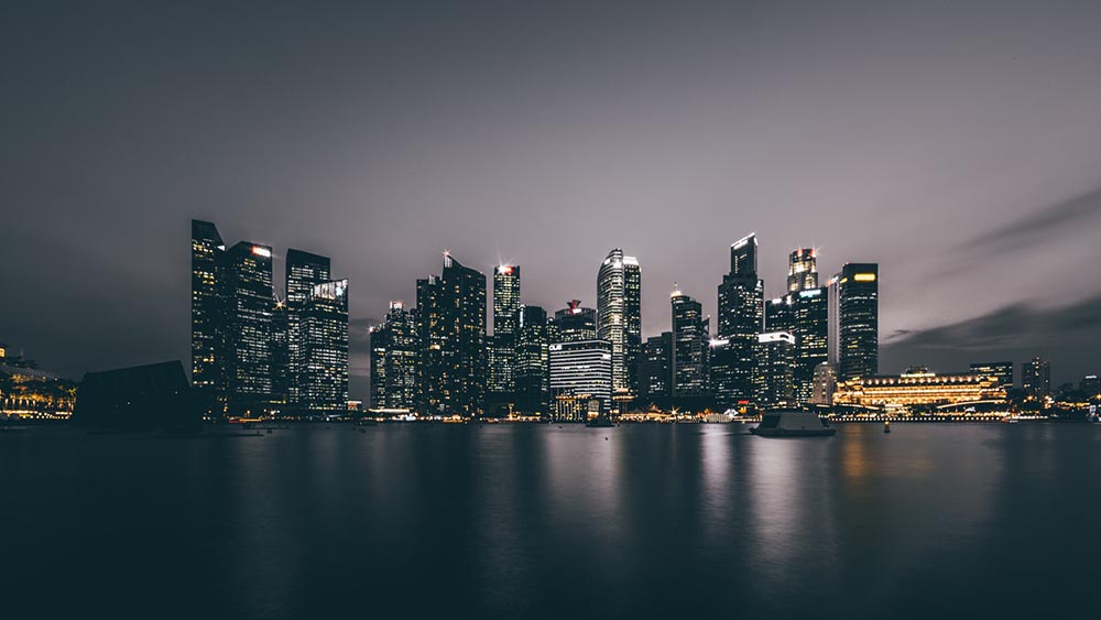 city buildings reflecting on the river