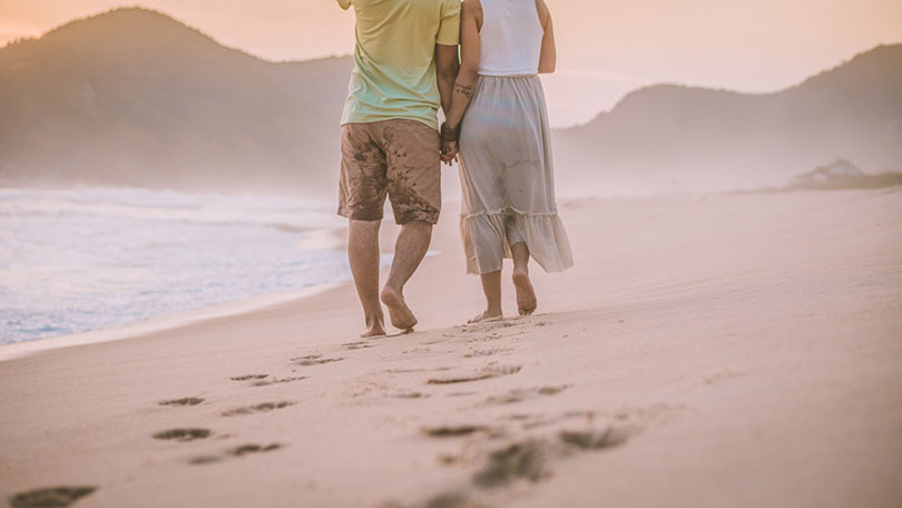 couple walking at the beach