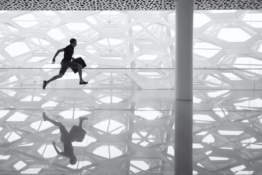 leaping man reflecting on the floor