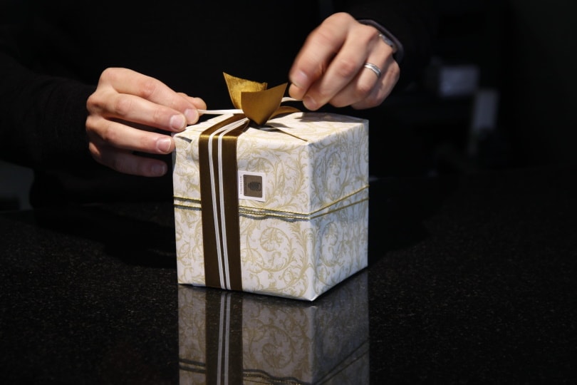 man holding a gift