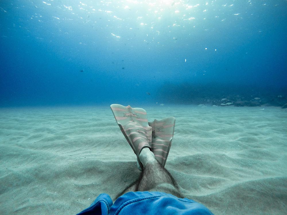 man sitting underwater