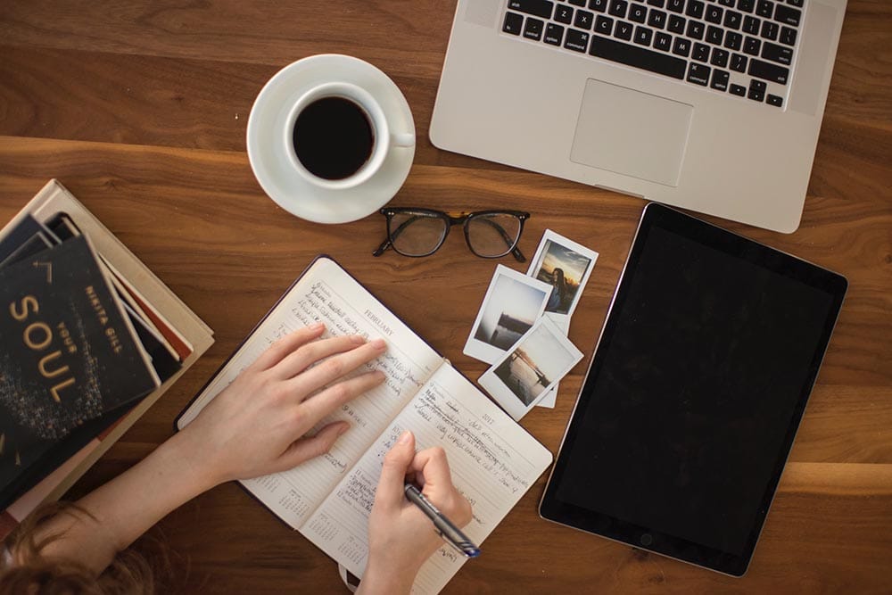 person writing a journal