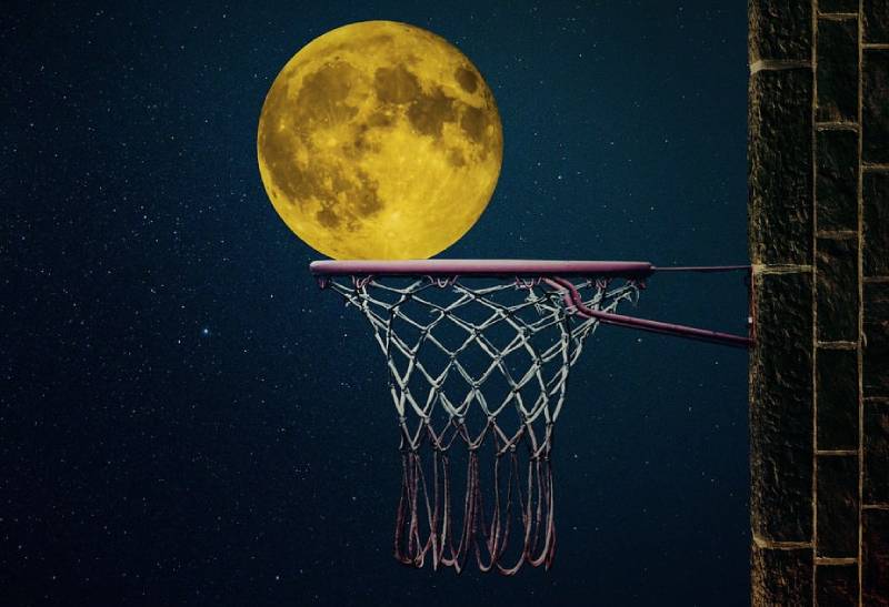 the moon and a basketball ring