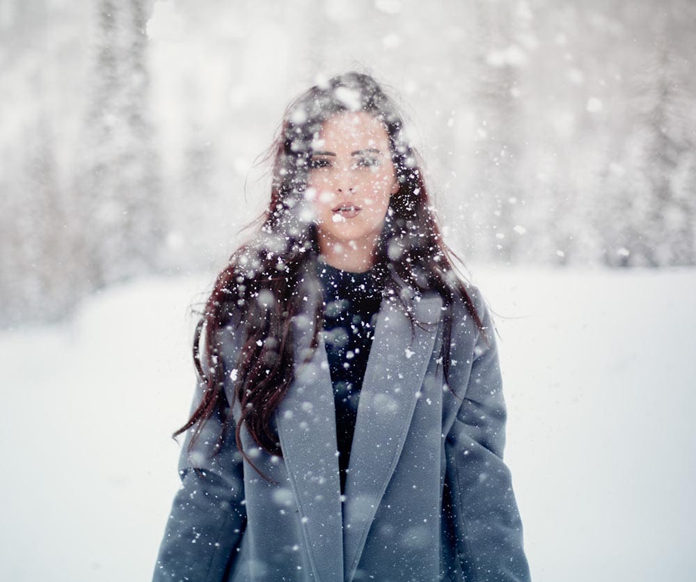 woman enjoying the snow fall