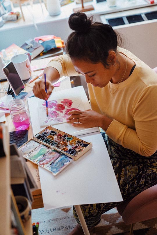 woman learning how to paint