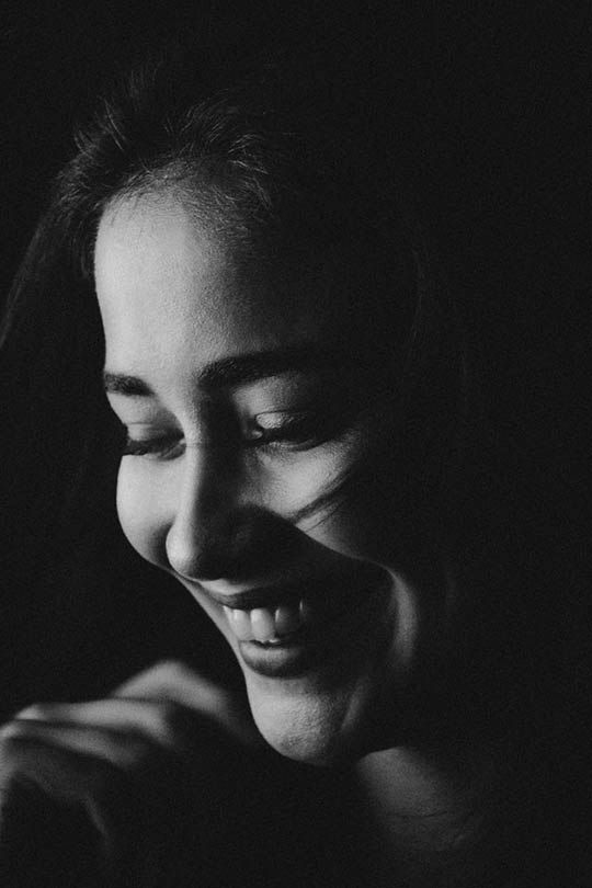 black and white portrait of a smiling woman