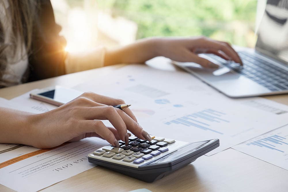 person using calculator for computation