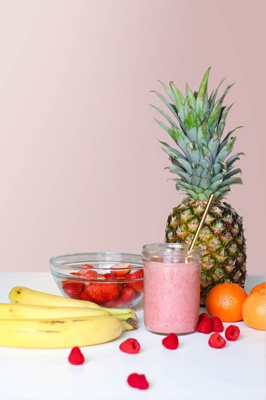 various fruits and a glass of fruit shake
