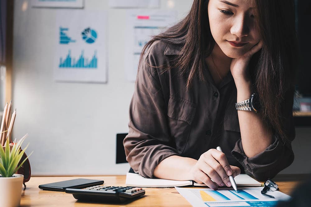 woman working on business taxes