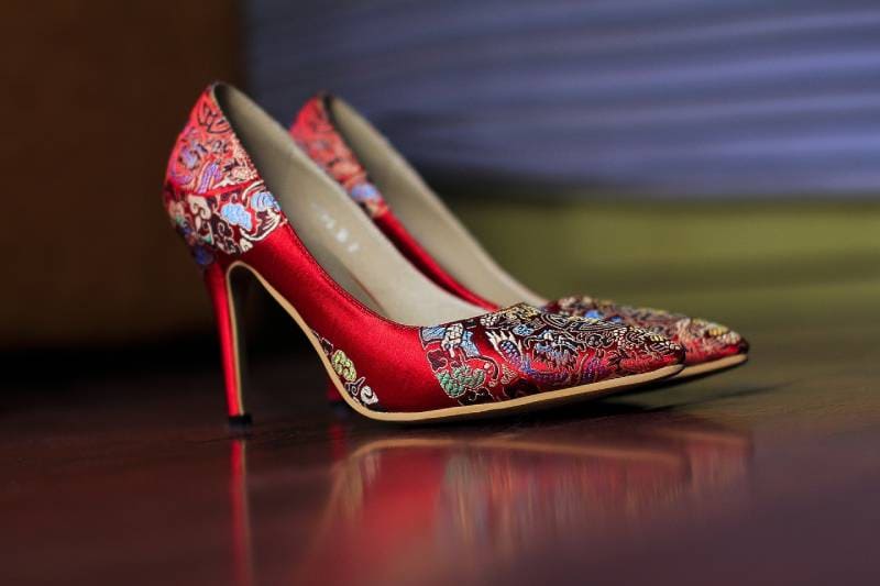 a beautiful red printed stilletos on the floor