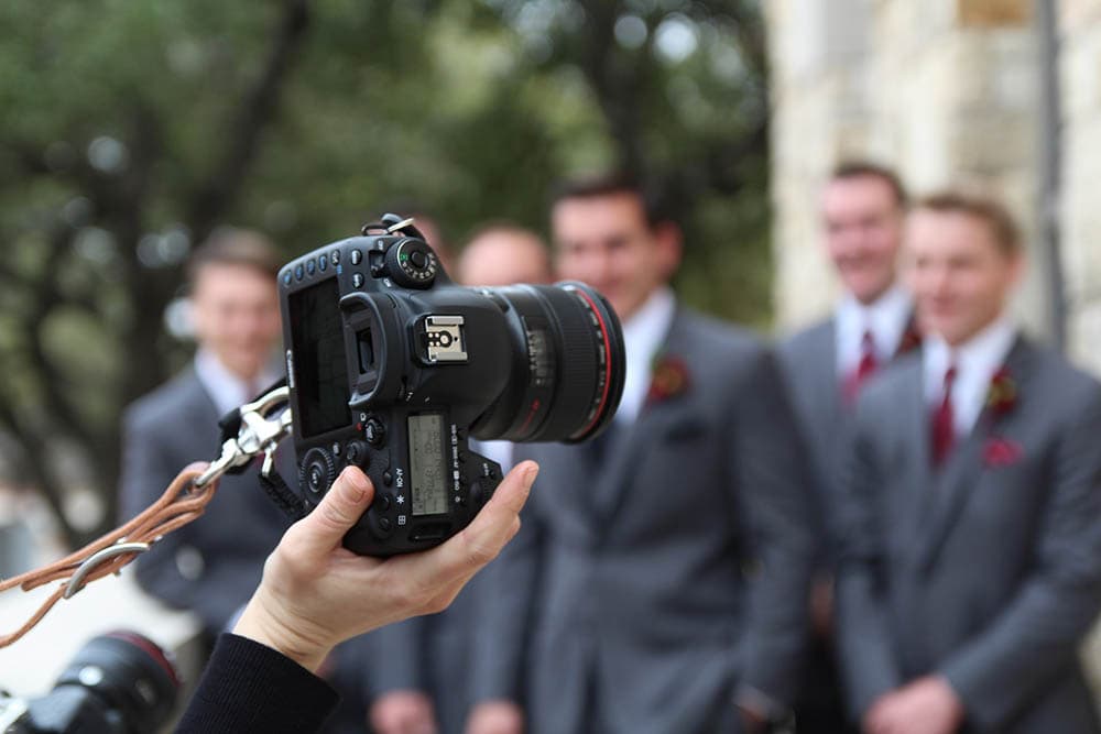 camera of a wedding photographer in action