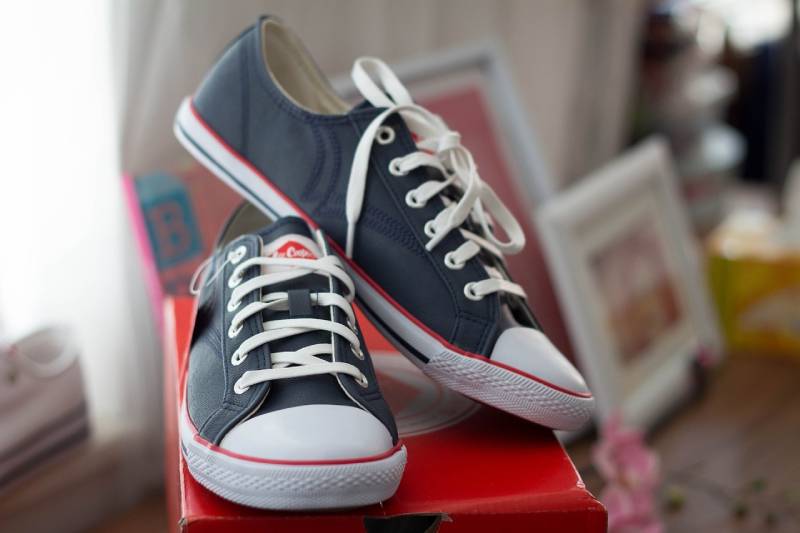 sneakers on top of shoe box