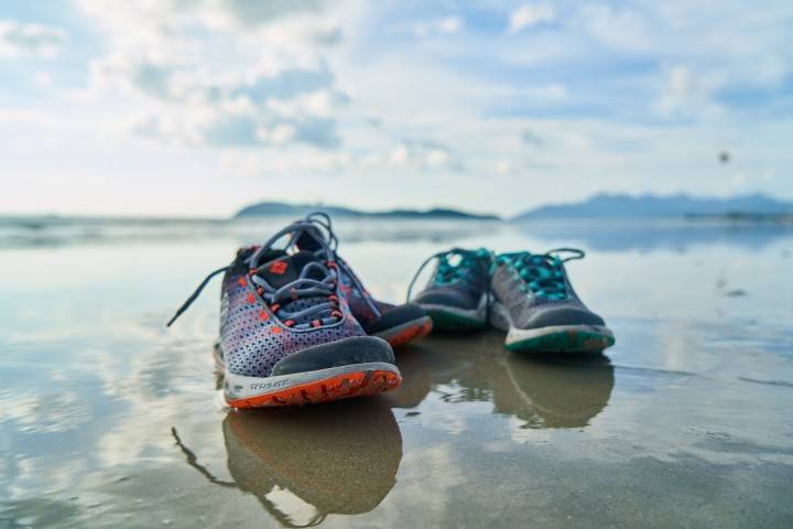 two pairs of shoes on water