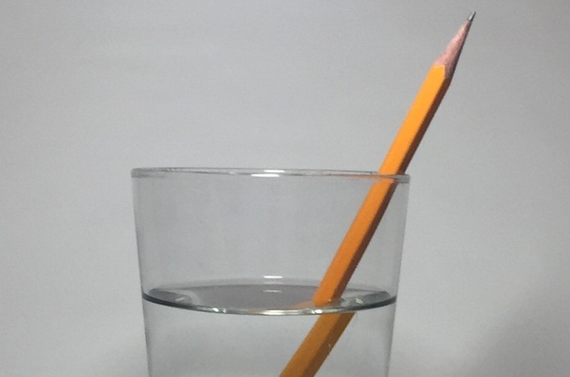 a pencil in a glass of water, an example of refraction