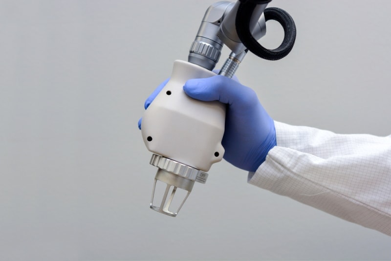 doctor holding CO2 laser hand piece