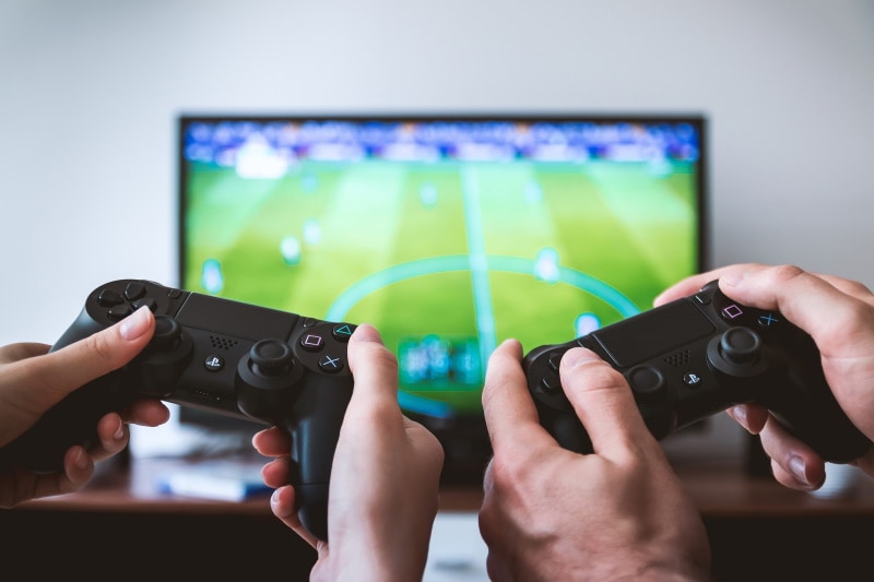 hands holding game controller