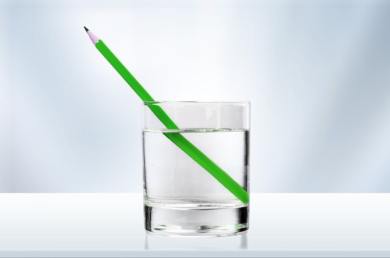 pencil in a glass of water, refraction of light
