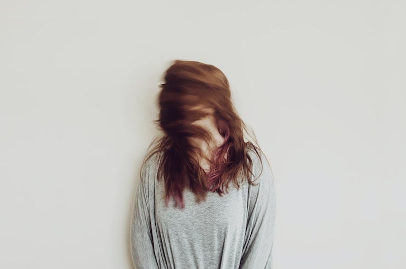 surreal motion blur photography woman shaking head