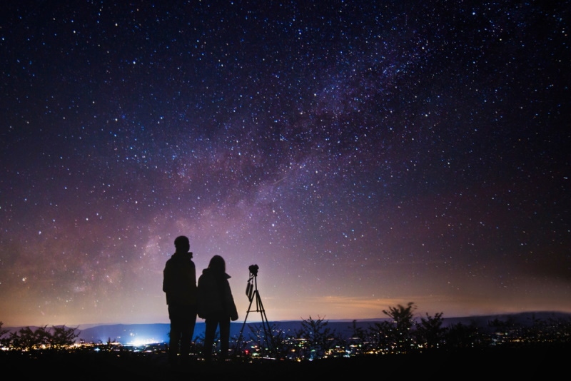 two person observing stars