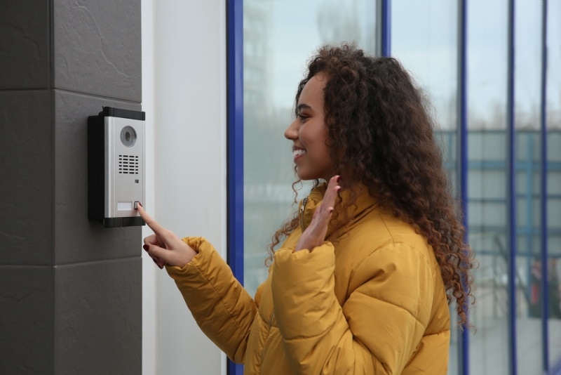 woman ringing door bell
