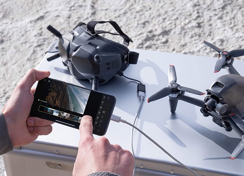 man looking at DJI FPV drone shots