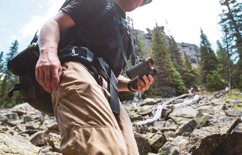 man using his Maven binoculars outdoors